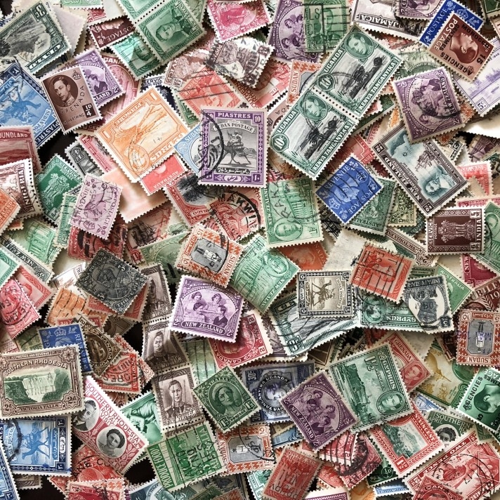 Early commonwealth stamps scatters on table